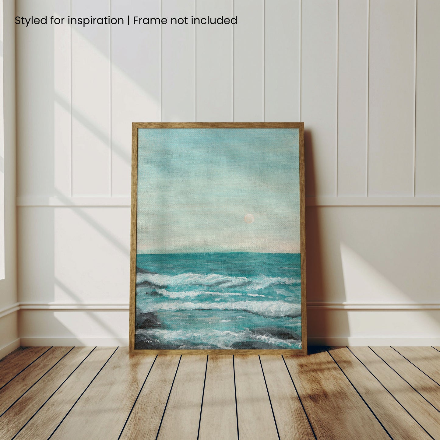 Painting of an ocean, with a wooden frame for display purposes.